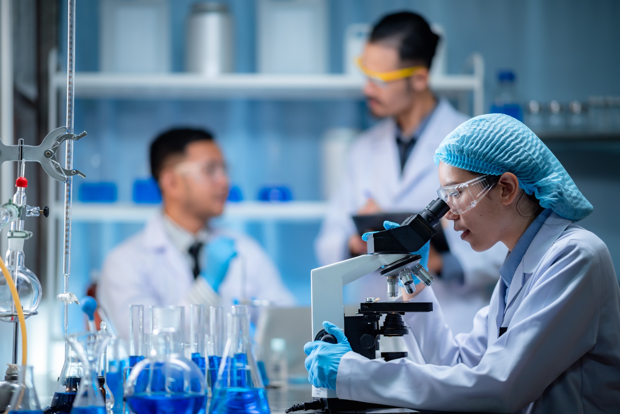 Researchers working with ingredients in a laboratory